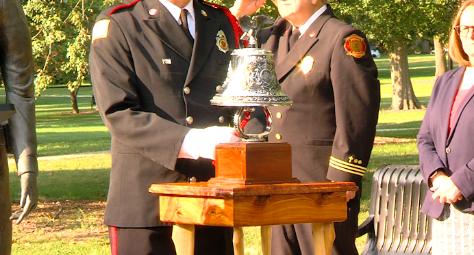 Champaign county fire department ring the bell to honor the lives lost on 9/11.